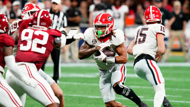 Dec 2, 2023; Atlanta, GA, USA; Georgia Bulldogs running back Kendall Milton (2) runs the ball in the second quarter against the Alabama Crimson Tide in the SEC Championship at Mercedes-Benz Stadium. Mandatory Credit: John David Mercer-USA TODAY Sports  